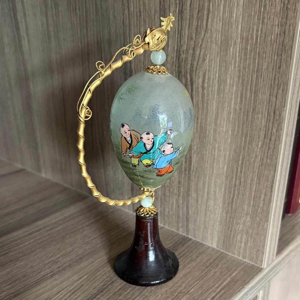 Hand-Painted Decorative Glass Egg with Gold Accents
